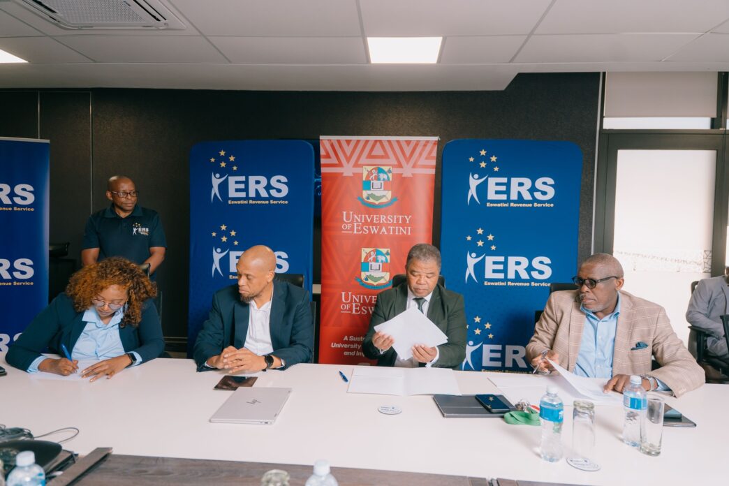 ERS Commissioner General and UNESWA Vice Chancellor Professor Justice M. Thwala exchange signed copies of the Memorandum of Understanding formalising a partnership to deliver specialised AI training for ERS employees through the UNESWA AI Academy. | Photo: ERS